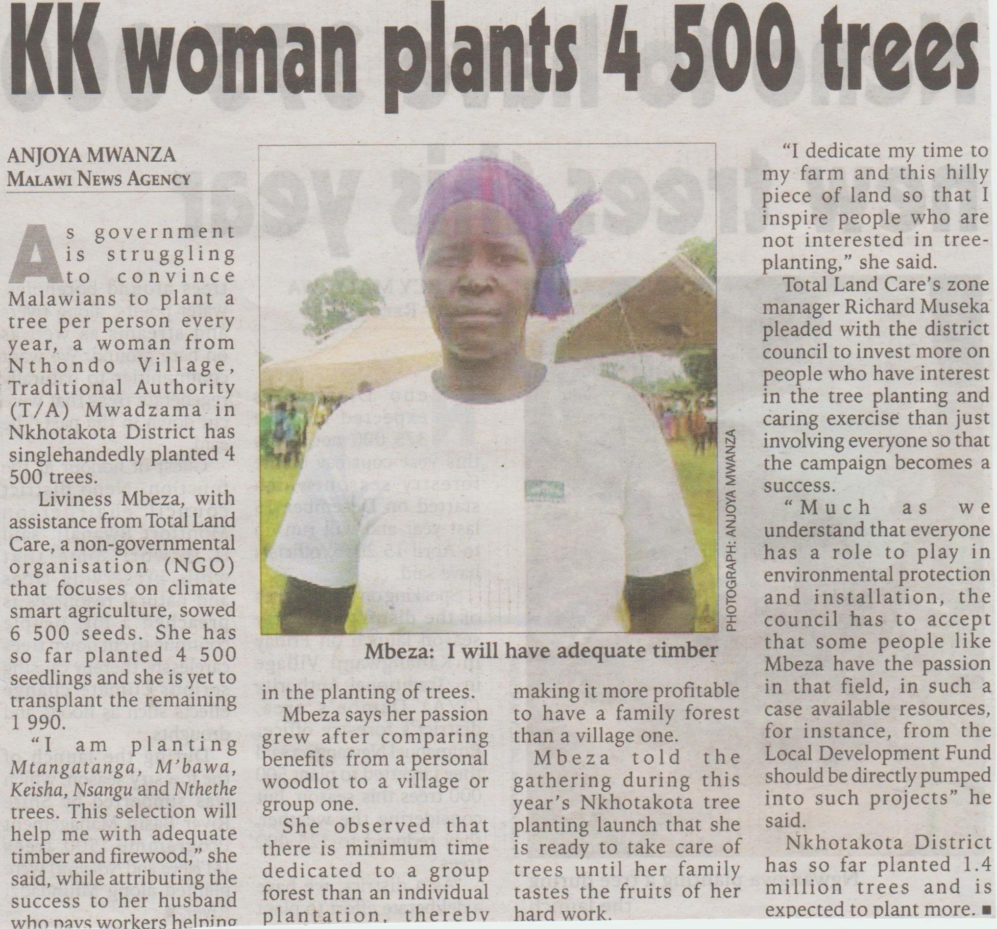 KK woman plants trees 001crop.jpg